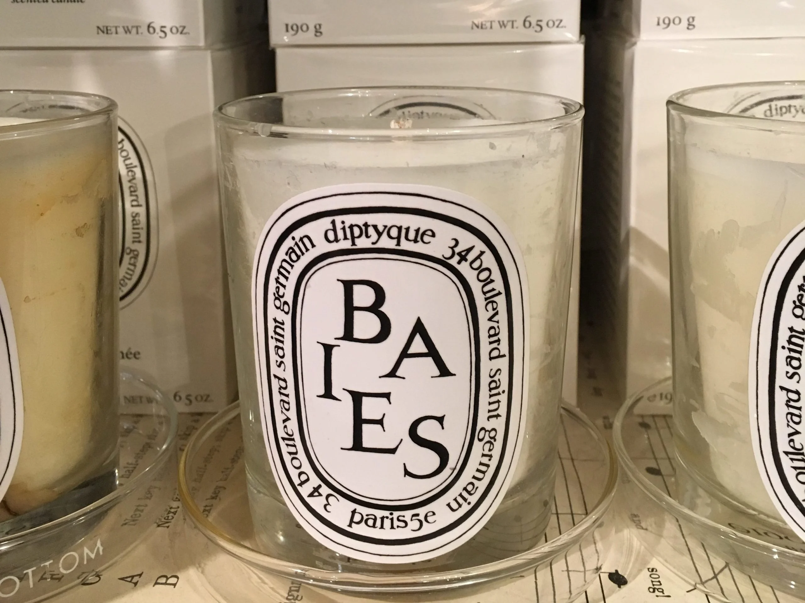 Diptyque Baies candle placed on a windowsill, offering a cozy and luxurious atmosphere.