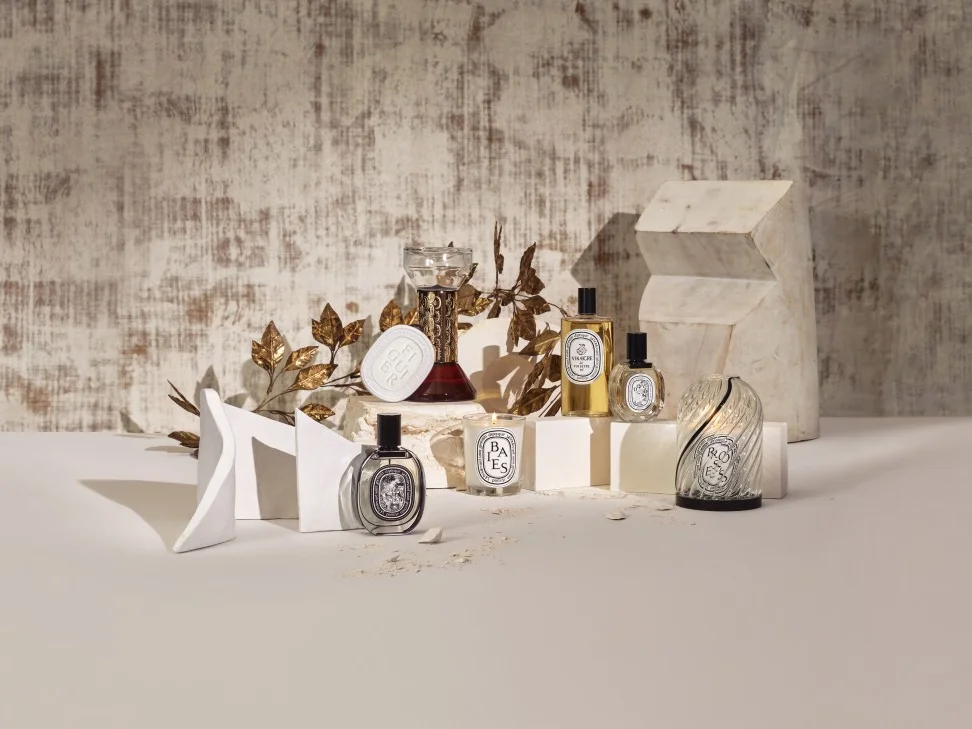 A variety of Diptyque Baies fragrance products including candles, room spray, and diffuser.