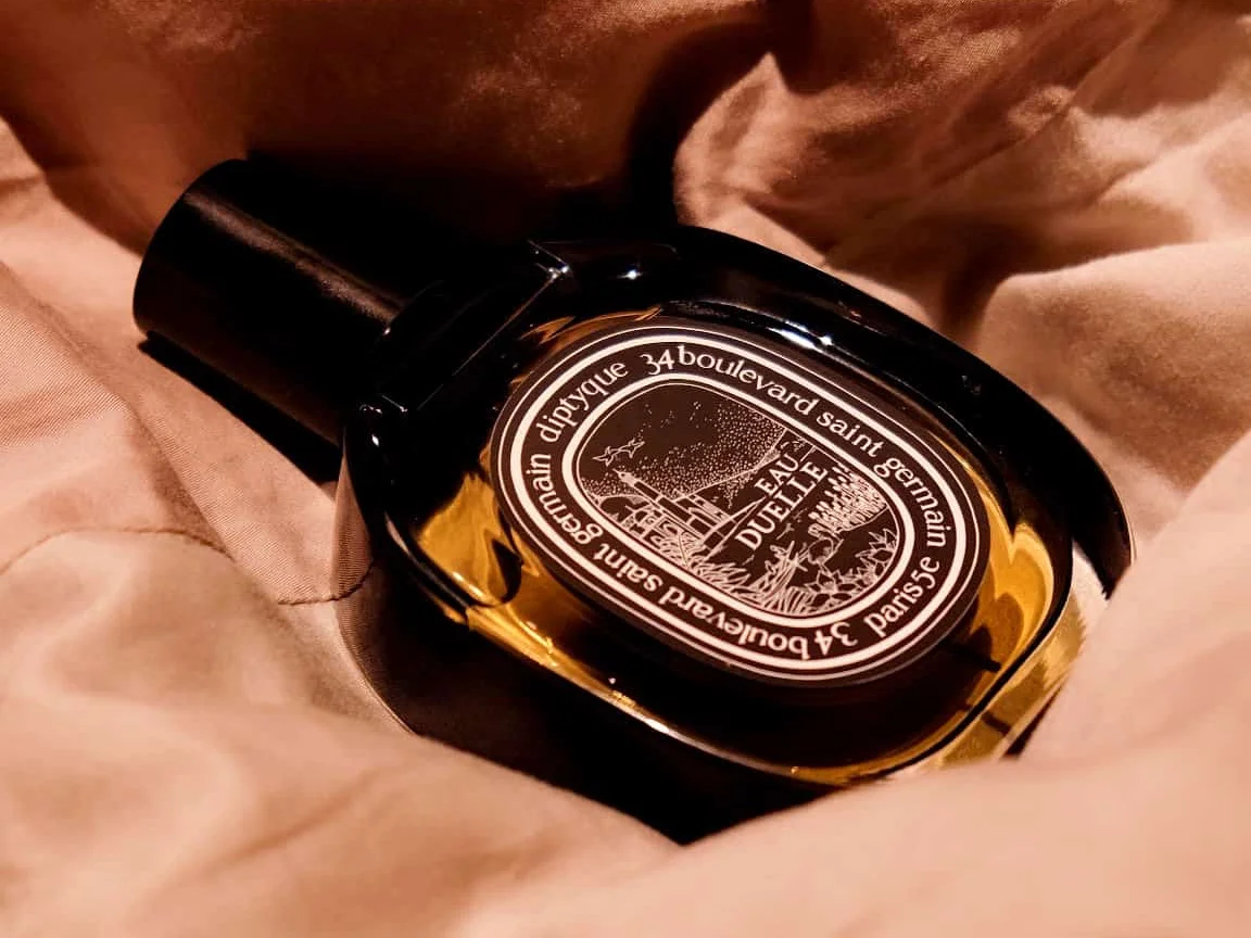 Bottle of Diptyque Eau Duelle perfume highlighting its rich vanilla fragrance, perfect for lovers of warm, spicy scents