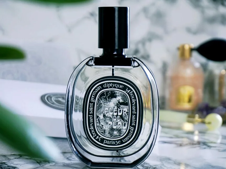 Bottle of Diptyque Fleur de Peau perfume, showcasing a delicate blend of powdery iris and musk notes