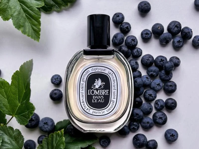 Bottle of Diptyque L'Ombre Dans L'Eau perfume, showcasing a blend of floral and fruity notes inspired by a lush garden