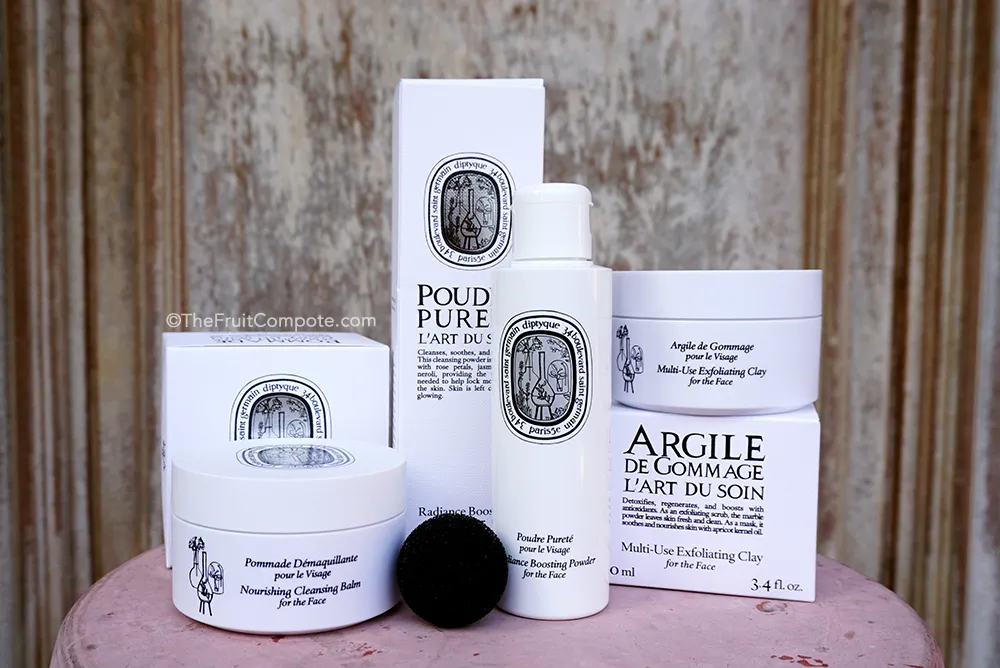 Diptyque skincare and body care products elegantly displayed with natural ingredients.